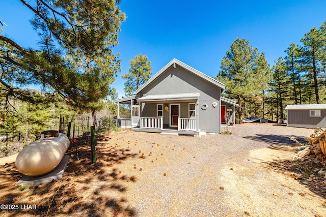 bungalow-style house with a porch and driveway