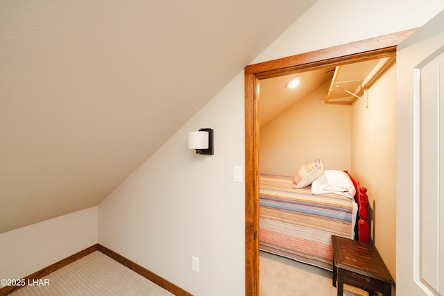 interior space featuring carpet flooring and lofted ceiling