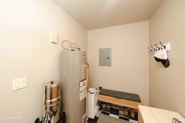 utility room featuring water heater and electric panel