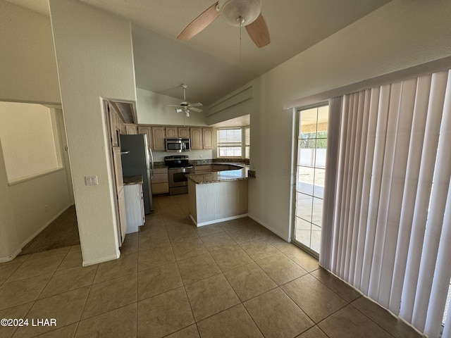 kitchen featuring lofted ceiling, light tile patterned floors, ceiling fan, appliances with stainless steel finishes, and kitchen peninsula