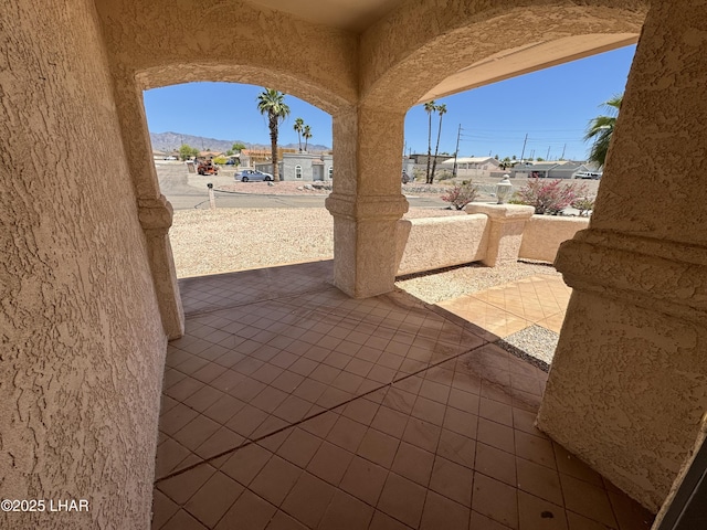 view of patio / terrace featuring a mountain view