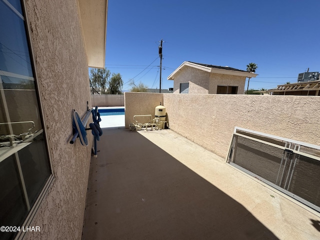 view of patio / terrace featuring a fenced in pool