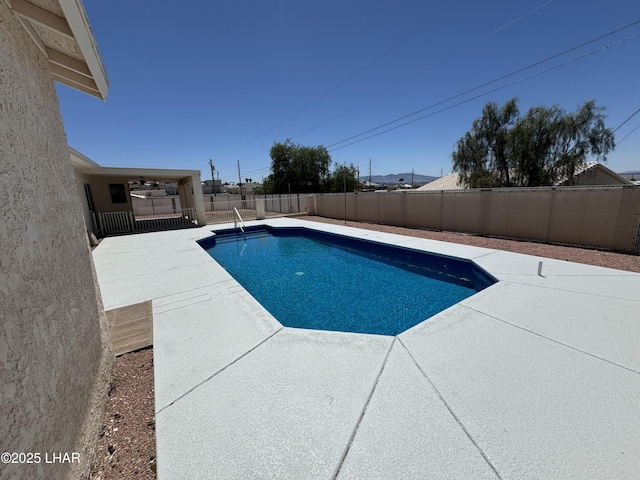 view of pool with a patio and ceiling fan