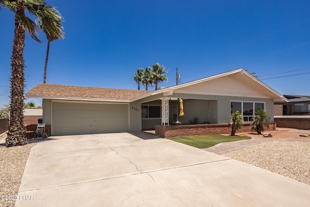 2593 Tradewind Dr, Lake Havasu City, AZ 86403 - single story home with a porch, a garage, and concrete driveway