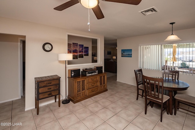2593 Tradewind Dr, Lake Havasu City, AZ 86403 - dining space with ceiling fan, light tile patterned floors, and baseboards