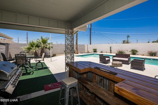 2593 Tradewind Dr, Lake Havasu City, AZ 86403 - fenced backyard with a patio, outdoor dining space, and area for grilling