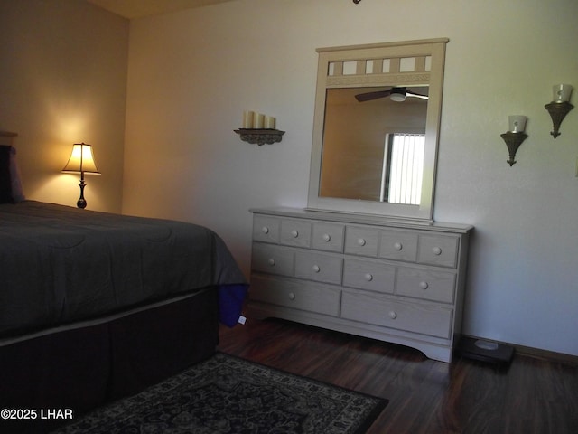 2085 Mesquite Ave Unit 76, Lake Havasu City, AZ 86403 - bedroom with dark wood-style flooring and baseboards