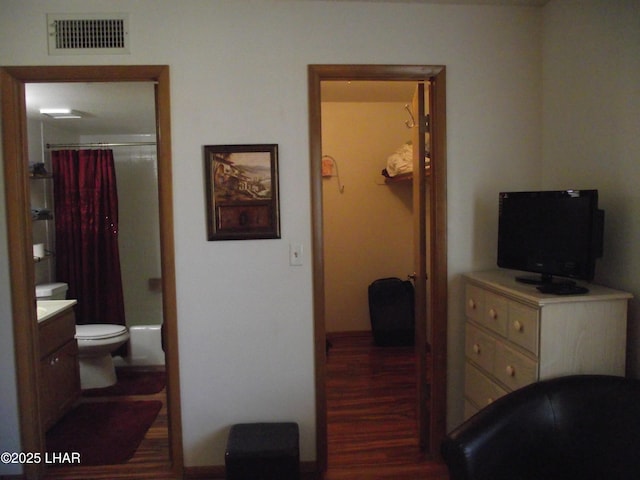 2085 Mesquite Ave Unit 76, Lake Havasu City, AZ 86403 - bedroom featuring wood finished floors, baseboards, and connected bathroom