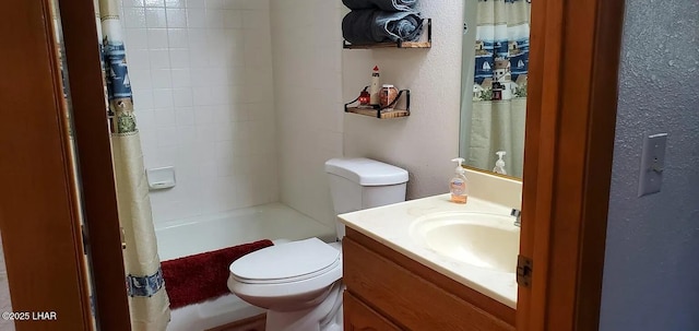 2085 Mesquite Ave Unit 76, Lake Havasu City, AZ 86403 - bathroom featuring vanity, toilet, shower / tub combo with curtain, and a textured wall