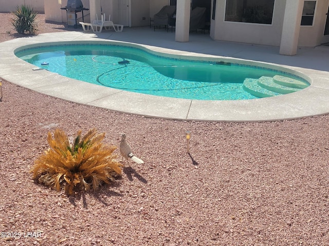 pool featuring a patio area