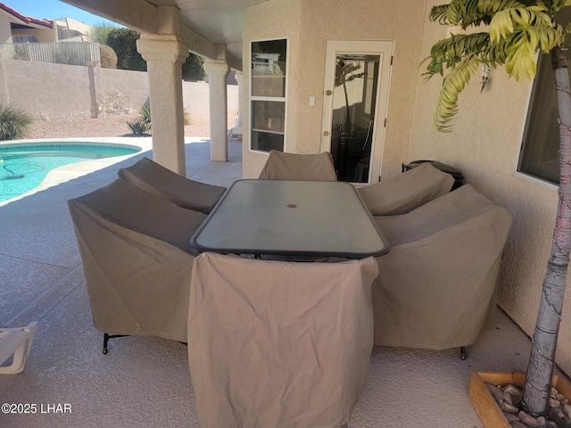 view of patio featuring a fenced in pool and fence