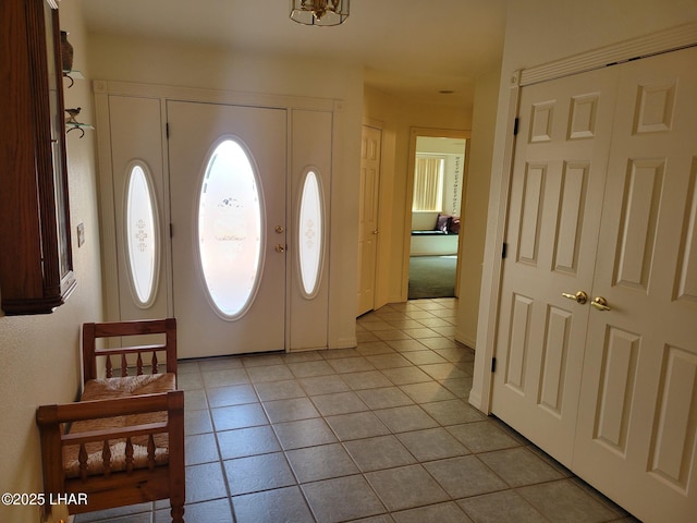 entrance foyer with light tile patterned floors