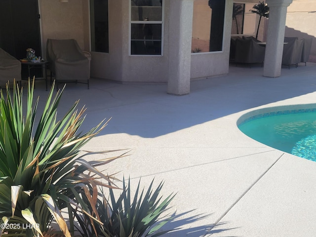 pool with a patio