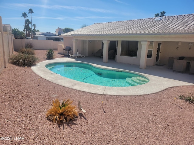 view of swimming pool with a patio, a fenced backyard, and a fenced in pool