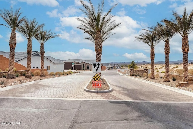 4718 N Banyan Ct, Lake Havasu City, AZ 86404 - view of street featuring traffic signs, a gated entry, curbs, and a residential view