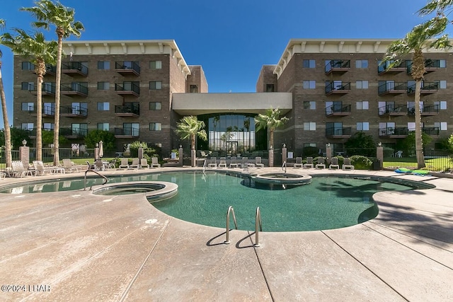 777 Harrah Way Unit 512, Lake Havasu City, AZ 86403 - view of pool featuring a patio area, fence, and a pool with connected hot tub