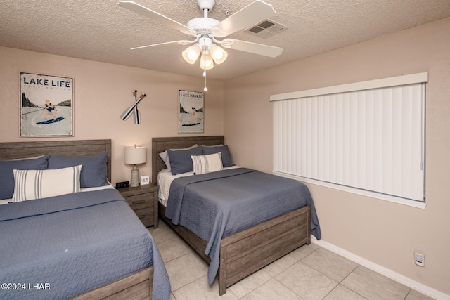777 Harrah Way Unit 512, Lake Havasu City, AZ 86403 - bedroom featuring baseboards, tile patterned floors, a textured ceiling, and visible vents
