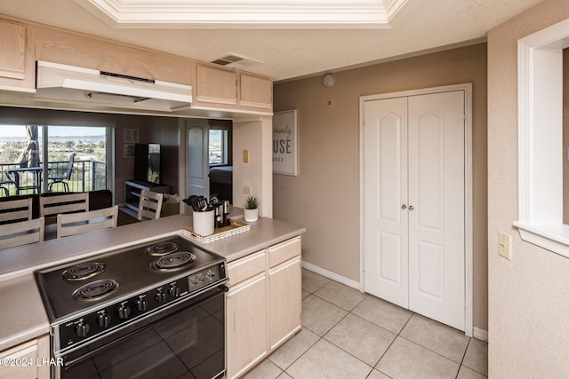 777 Harrah Way Unit 512, Lake Havasu City, AZ 86403 - kitchen with visible vents, crown molding, black electric range oven, light brown cabinets, and light countertops