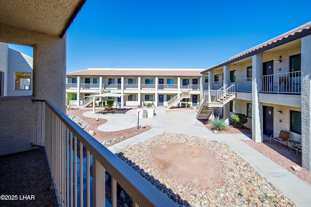 view of home's community with stairs