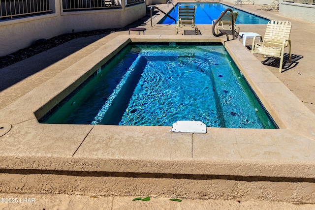 community pool featuring a patio