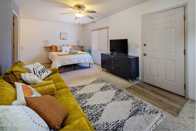 bedroom featuring wood finished floors and ceiling fan