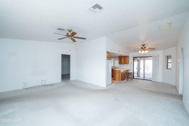 unfurnished living room featuring ceiling fan