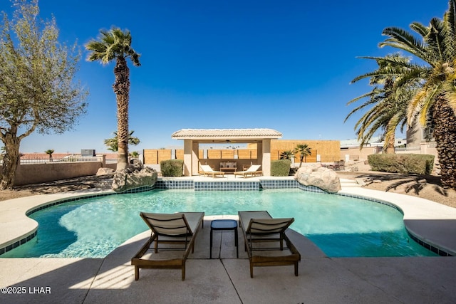 view of swimming pool featuring a fenced in pool, a patio area, a fenced backyard, and an outdoor living space