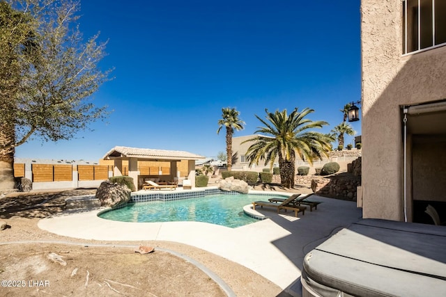 view of swimming pool with a patio area, a fenced backyard, and a fenced in pool