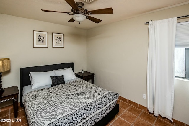 bedroom featuring a ceiling fan and tile patterned floors