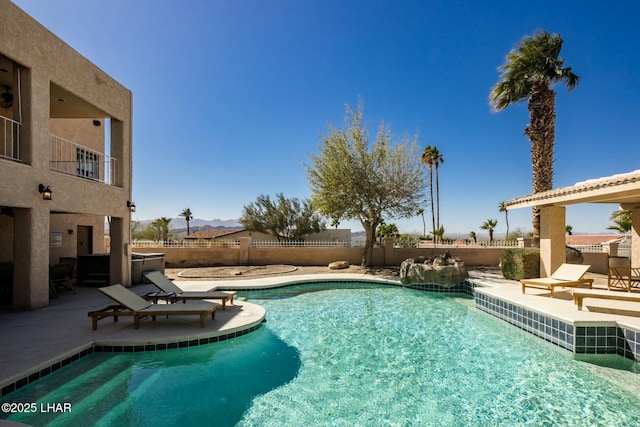 view of swimming pool with a patio area, fence, and a fenced in pool