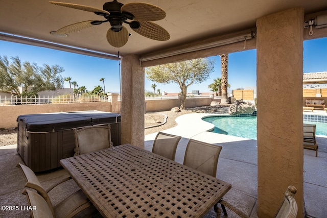 view of patio / terrace featuring a hot tub, a fenced in pool, a fenced backyard, ceiling fan, and outdoor dining space