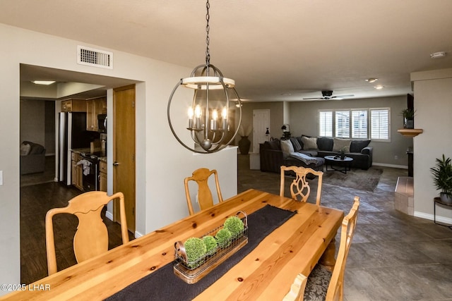 dining room featuring visible vents, baseboards, and ceiling fan with notable chandelier