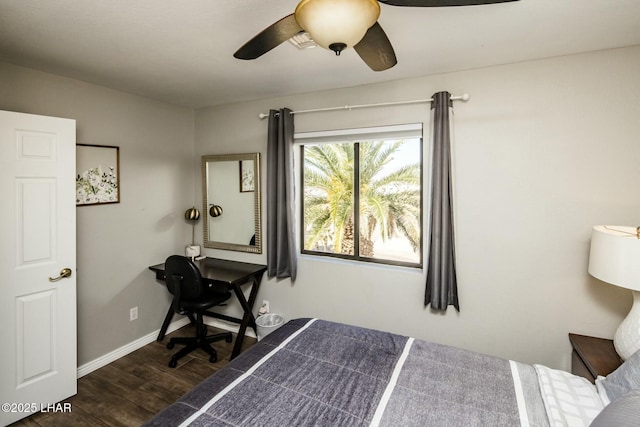 bedroom featuring dark wood-style floors, ceiling fan, and baseboards