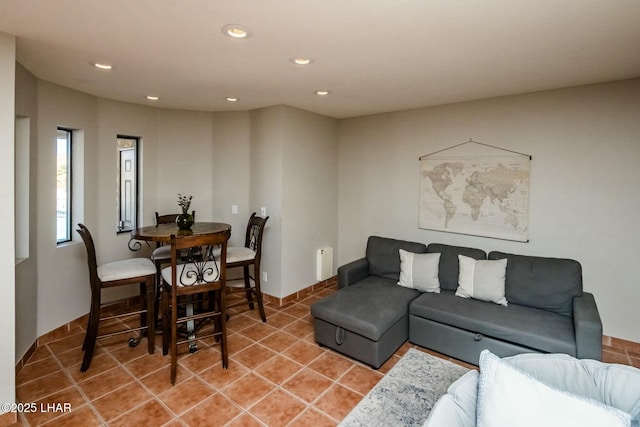 living area featuring light tile patterned flooring and recessed lighting