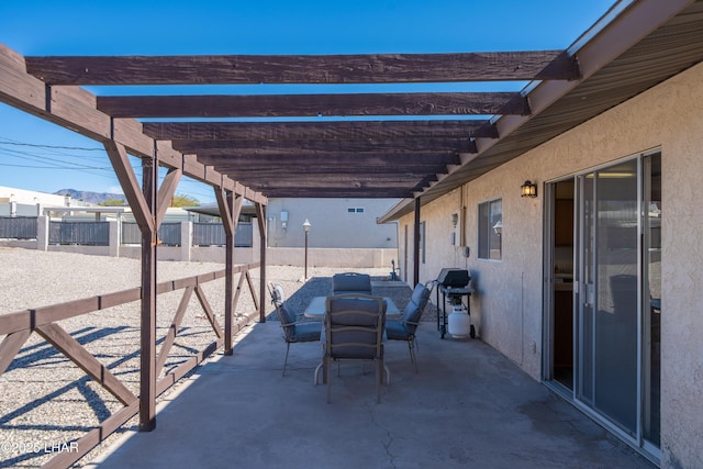 view of patio / terrace featuring outdoor dining space, grilling area, fence, and a pergola