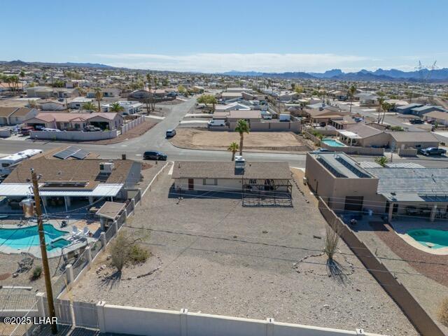 birds eye view of property with a residential view and a mountain view