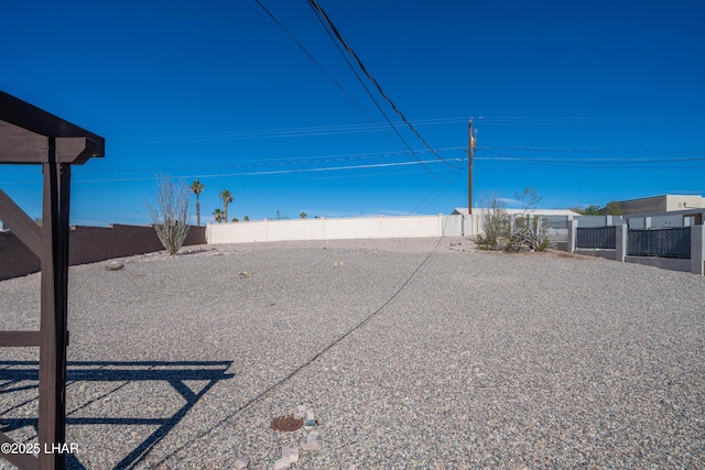 view of yard with a fenced backyard