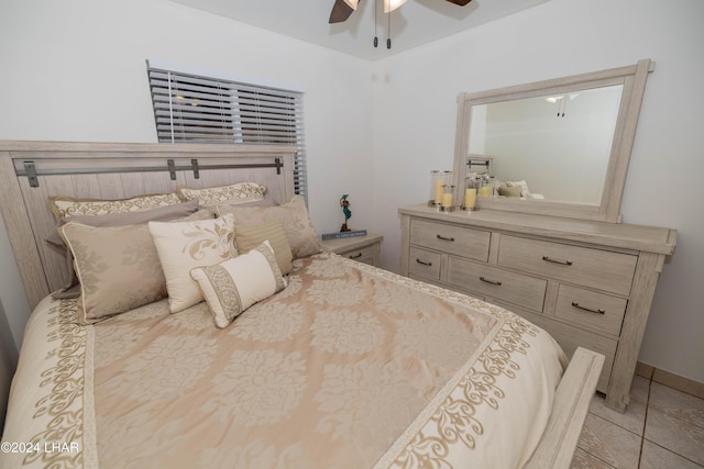 tiled bedroom with ceiling fan