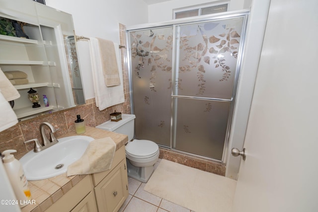 bathroom with decorative backsplash, tile patterned flooring, vanity, an enclosed shower, and toilet