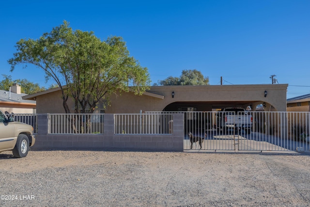 view of front of property featuring a carport