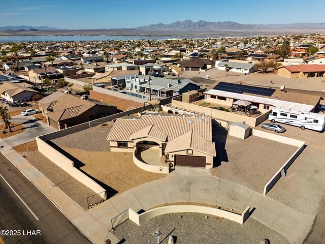 birds eye view of property with a mountain view