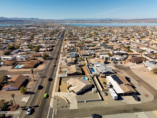 bird's eye view with a water and mountain view