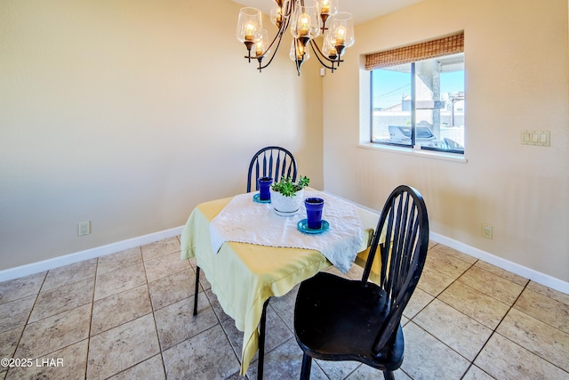 tiled dining area featuring a chandelier