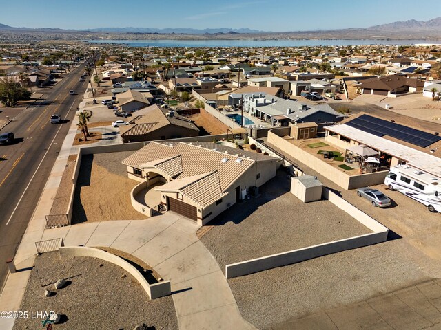 aerial view featuring a water and mountain view