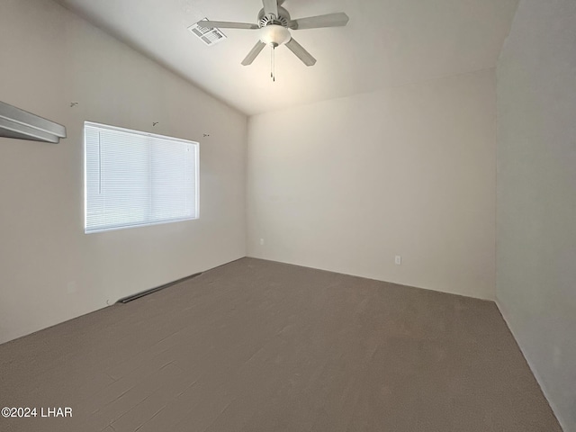 unfurnished room featuring ceiling fan, carpet flooring, and vaulted ceiling