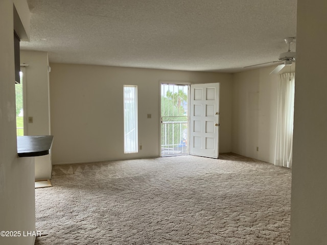 1755 Los Lagos Dr Unit D, Lake Havasu City, AZ 86403 - unfurnished room featuring a textured ceiling, carpet floors, and a ceiling fan