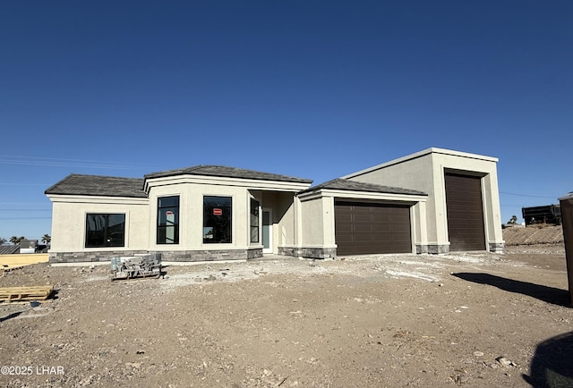 view of front of house featuring stucco siding