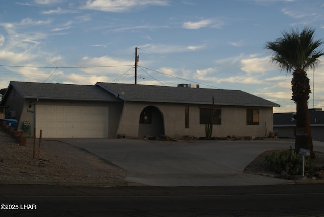 3098 Mcculloch Blvd N, Lake Havasu City, AZ 86403 - ranch-style house with a garage, driveway, and stucco siding