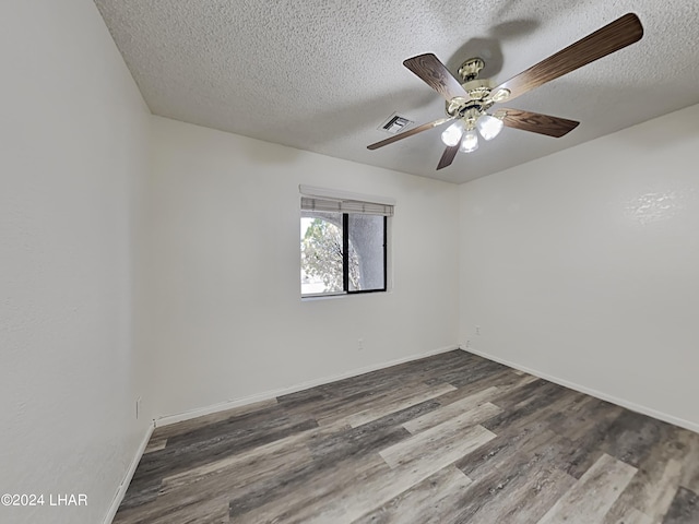 3098 Mcculloch Blvd N, Lake Havasu City, AZ 86403 - spare room with a textured ceiling, a ceiling fan, baseboards, wood finished floors, and visible vents