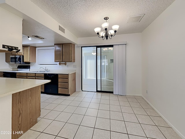 3098 Mcculloch Blvd N, Lake Havasu City, AZ 86403 - kitchen with a textured ceiling, black dishwasher, stainless steel microwave, visible vents, and range with electric stovetop